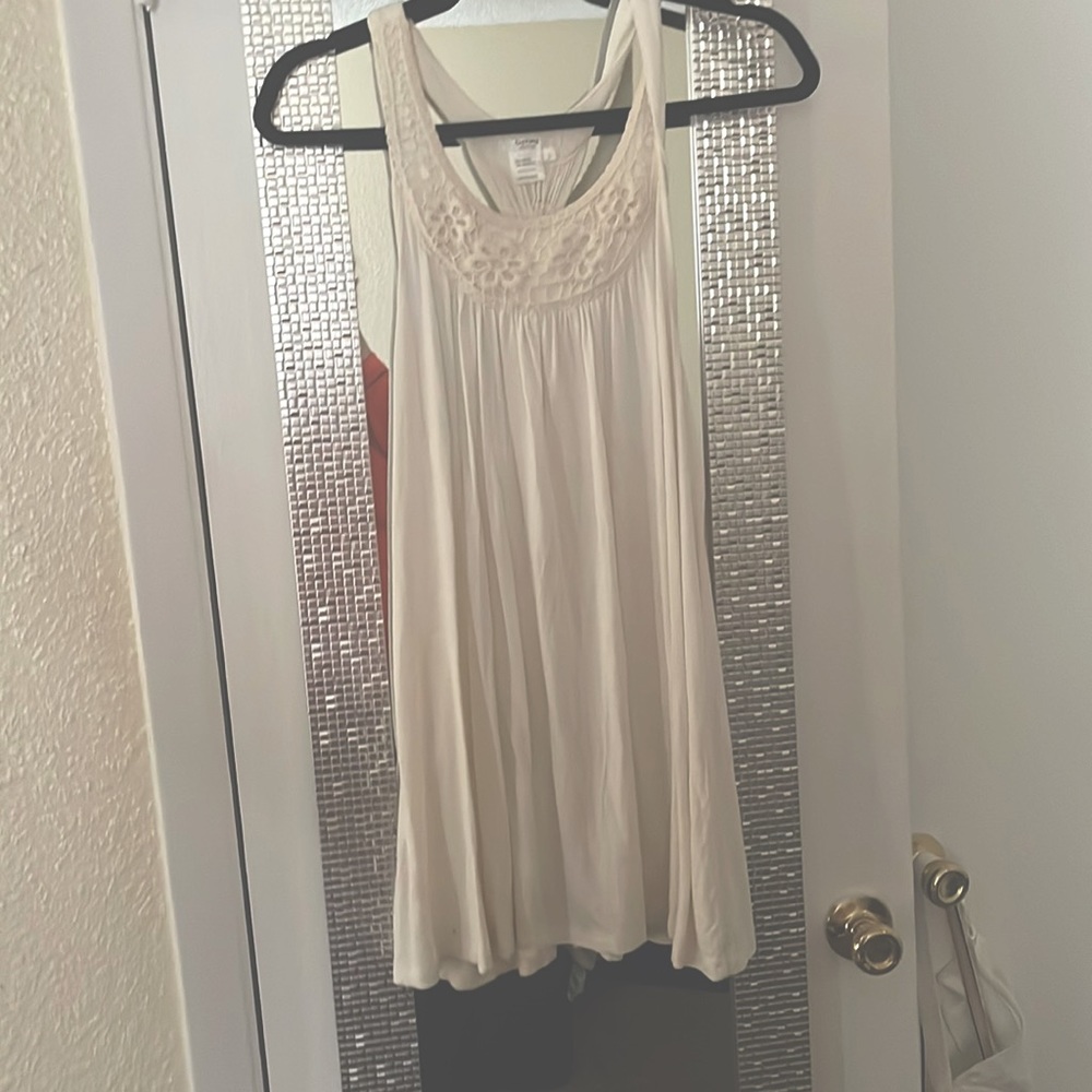 Cream tank top blouse.